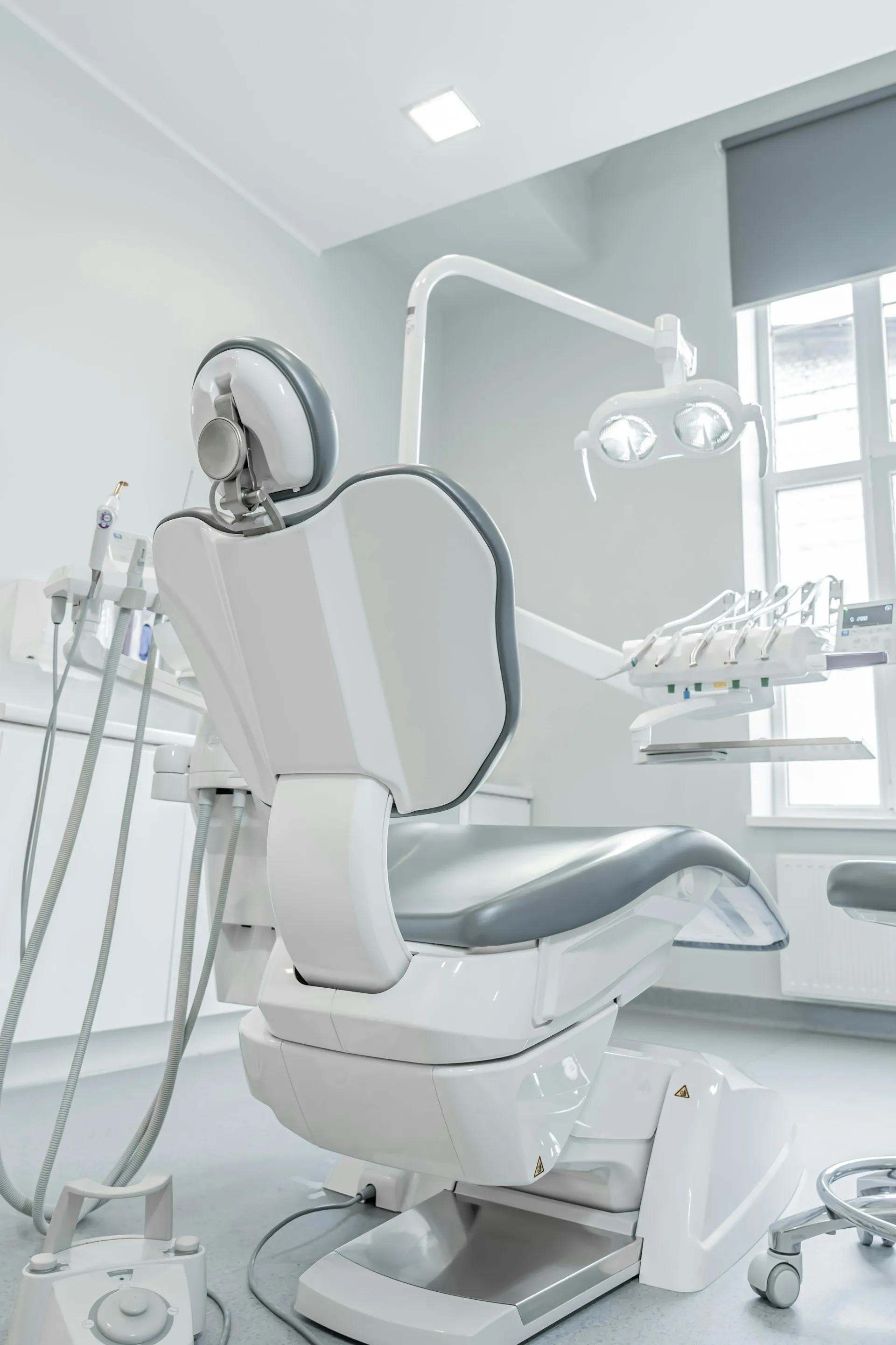 Dental chair beside a window with natural light